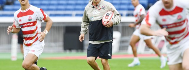 Eddie Jones (Head Coach) and Yoji Nagatomo (Team Director) react to the draw