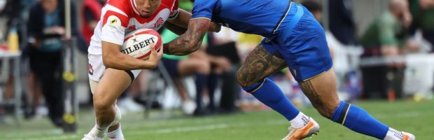 Takuro-Matsunaga-of-Japan-is-tackled-by-Monty-Ioane-of-Italy-dur